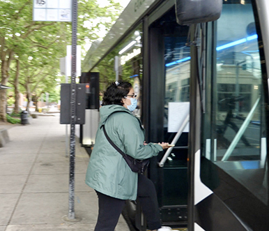 Woman boarding a bus