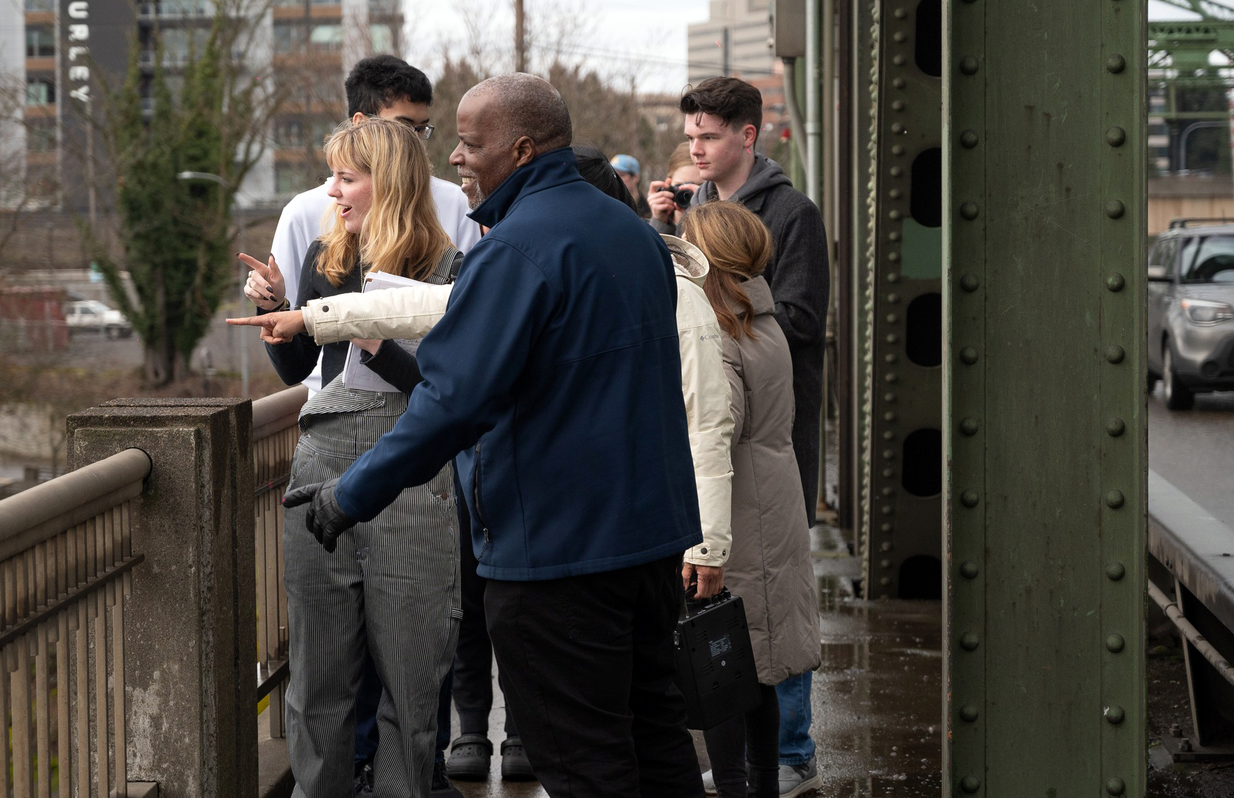 A group of students on the bridge with Program Administrator Greg Johnson