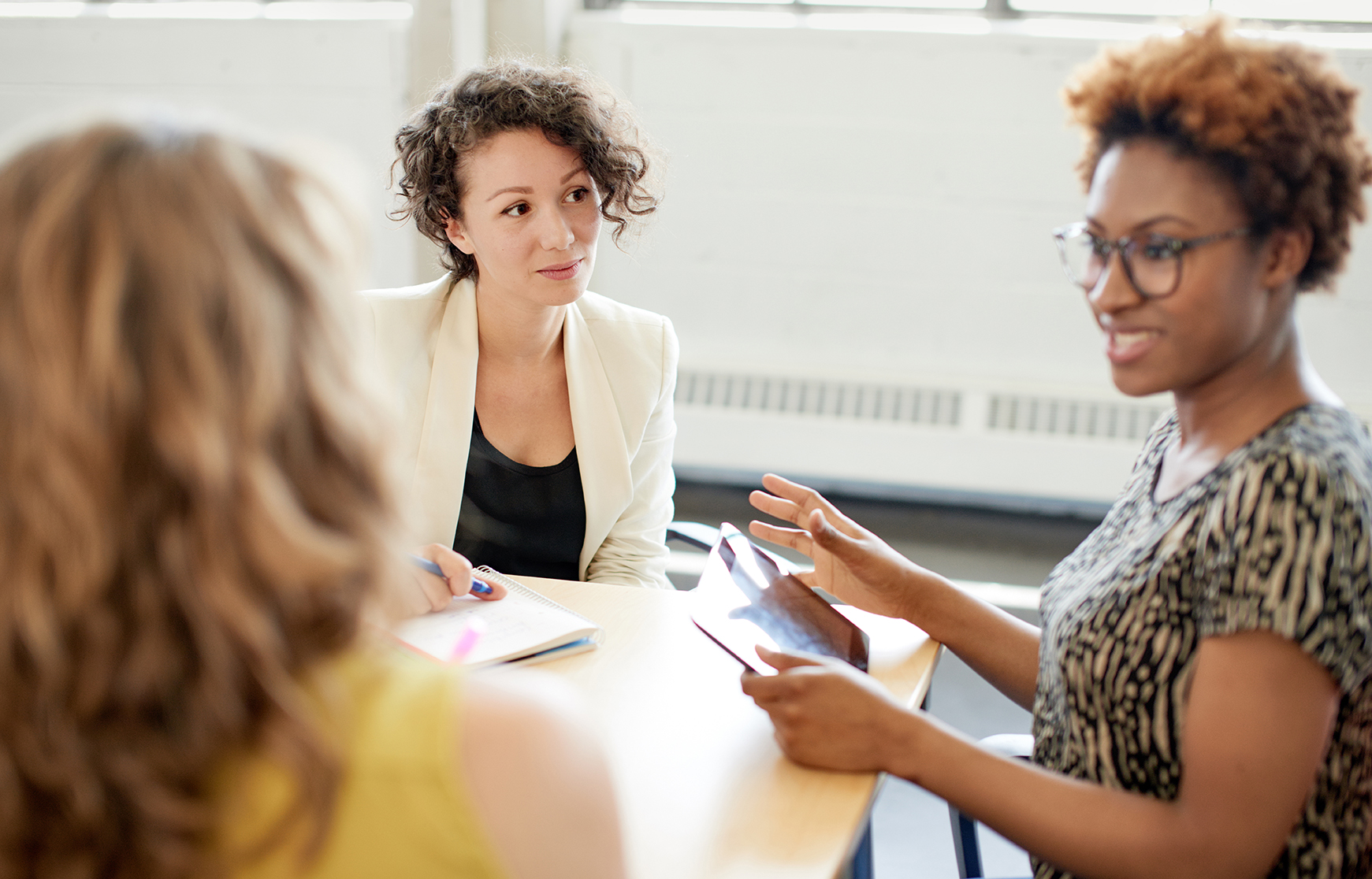 Community Engagement Meeting with three women